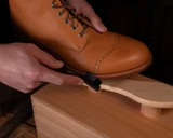 This is a lifestyle image of the shoe shine kit being used