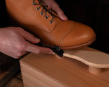 High quality lifestyle image of the shoe shine kit being used