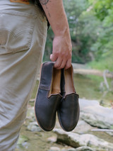 High quality lifestyle image of the barefoot slip on shoe