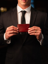 High quality lifestyle view of the Newton leather wallet in reddish brown