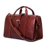 High quality side view of the Taylor leather Duffle Bag in reddish brown