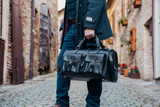 High quality lifestyle view of the Wesley Deep Pocket Duffle in Italian Black Leather