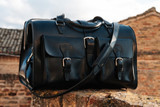 High quality lifestyle view of the Wesley Deep Pocket Duffle in Italian Black Leather