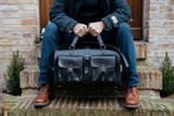High quality lifestyle view of the Wesley Deep Pocket Duffle in Italian Black Leather