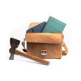 High quality front side of a tan brown leather satchel with a front pocket empty.