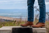 This is the lifestyle image of the Huntsman boot in natural patina