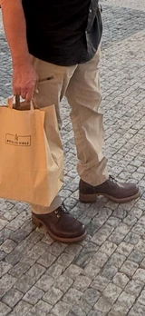 High quality side view of the Huntsman boot in dark brown on a person