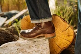 High-quality dark brown boots showing on a model