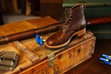 High-quality dark brown boots showing  side view