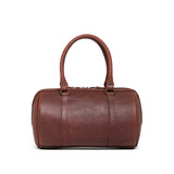 High quality front view of the everyday barrel leather purse in reddish brown