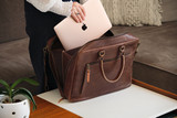 High quality lifestyle image of the women's business leather satchel in dark brown