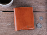 This is the lifestyle image of the Silverback Large Bifold Wallet in light tan