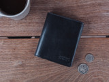 High quality lifestyle image of the Silverback Large Bifold leather Wallet in black