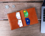 This is the lifestyle image of the Silverback Large Bifold Wallet in light tan