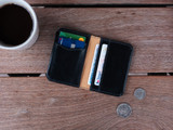 High quality lifestyle image of the Silverback Slim Bifold leather Wallet in Black