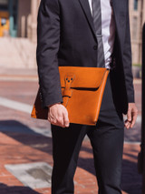 High quality lifestyle image of the document leather holder in tan