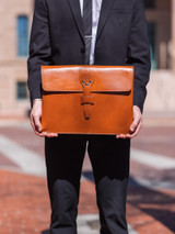 This is the lifestyle image of the document holder in tan