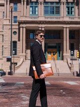 This is the lifestyle image of the document holder in tan