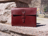 This is the lifestyle image of the document holder in reddish brown