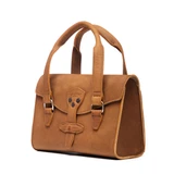 This is the side view of the double handle purse in light brown