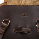 High quality open side view of the double handle leather purse in dark brown