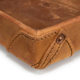 High quality this leather catchall valet tray can hold a lot because the corner of this tan brown one is so strong.