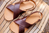 This is a lifestyle image  of the Jesus sandles