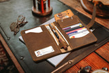 High quality lifestyle image of the Big leather Wallet in tan