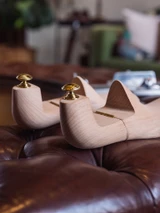 High quality wooden shoe trees rear view showing brass knobs and hinges - Saddleback Leather