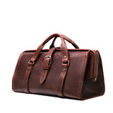 This is the side view of the reddish brown leather range and tool bag