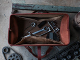 High quality lifestyle view of the leather range and tool bag