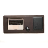 High quality lifestyle image of Long desk pad in dark brown