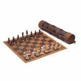 High quality leather travel chess set that is rolled up with a shoulder strap over the shoulder and also open and set up.