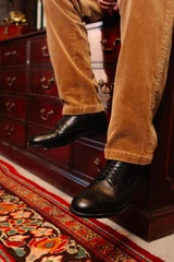 High quality black full grain leather wing tip shoes studio shown on a model - Saddleback Leather