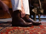 High quality dark oak full grain leather toe cap shoes lifestyle shot with vintage shoehorn on oriental rug - Saddleback Leather