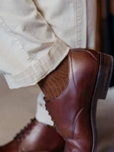 High quality close-up of dark oak full grain leather toe cap shoe heel counter and stacked leather heel - Saddleback Leather
