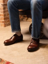 High quality overhead close-up of dark oak full grain leather toe cap shoe brogue detail and vamp - Saddleback Leather