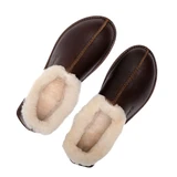 High quality these are the dark brown leather sheepskin mocassins showing the overall shape and crease down the center better. Made by Saddleback
