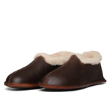 High quality dark brown leather sheepskin mocassins at a side angle and crease down the center. Made by Saddleback
