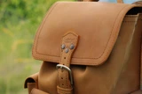 High quality front pocket backpack in light brown in side view