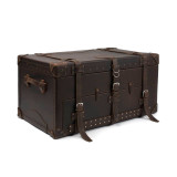 High quality leather trunk that will be a vintage antique one day in a museum. This is the front angled side. It is a dark brown steamer trunk that was old time luggage back in the day on trains and ships.