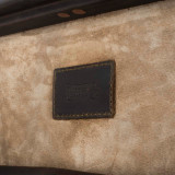High quality leather trunk that will be a vintage antique one day in a museum. This is the leather tag on the inside. It is a dark brown steamer trunk that was old time luggage back in the day on trains and ships.