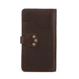 High quality back of a dark brown really large leather wallet.