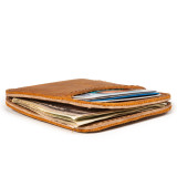 High quality tan brown leather wallet laying down flat.
