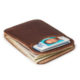 High quality red brown leather wallet laying down.