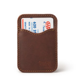 High quality front of a red brown leather wallet standing with no cash.