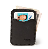High quality black leather wallet standing with cash.