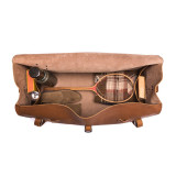 High quality this leather duffle bag is tan brown and has three straps on it . It is showing the inside.