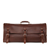 High quality this leather duffle bag is red brown and has three straps on it. It is showing the front side.