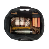 High quality interior of a black leather duffle bag that is wide open and the overnight travel gear can be seen inside.